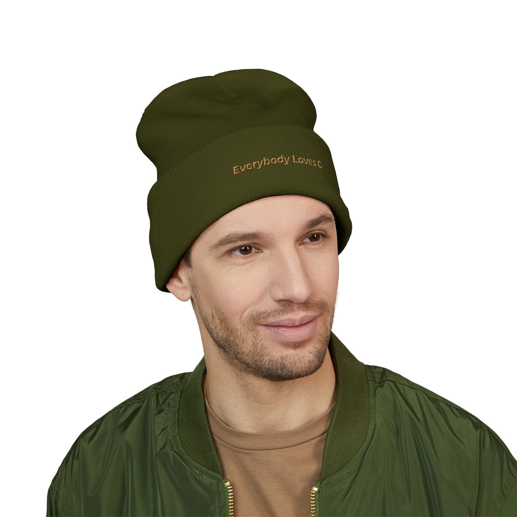Model wearing olive green Everybody Loves G beanie on white background