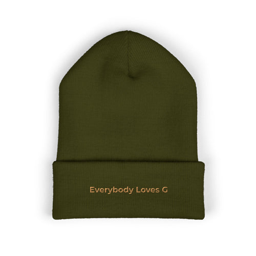 Olive green embroidered beanie with “Everybody Loves G” text on front on a white background