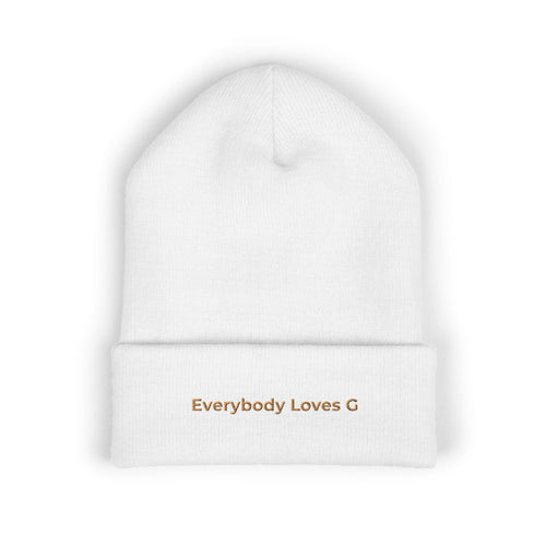 White beanie with 'Everybody Loves G' text on a white background