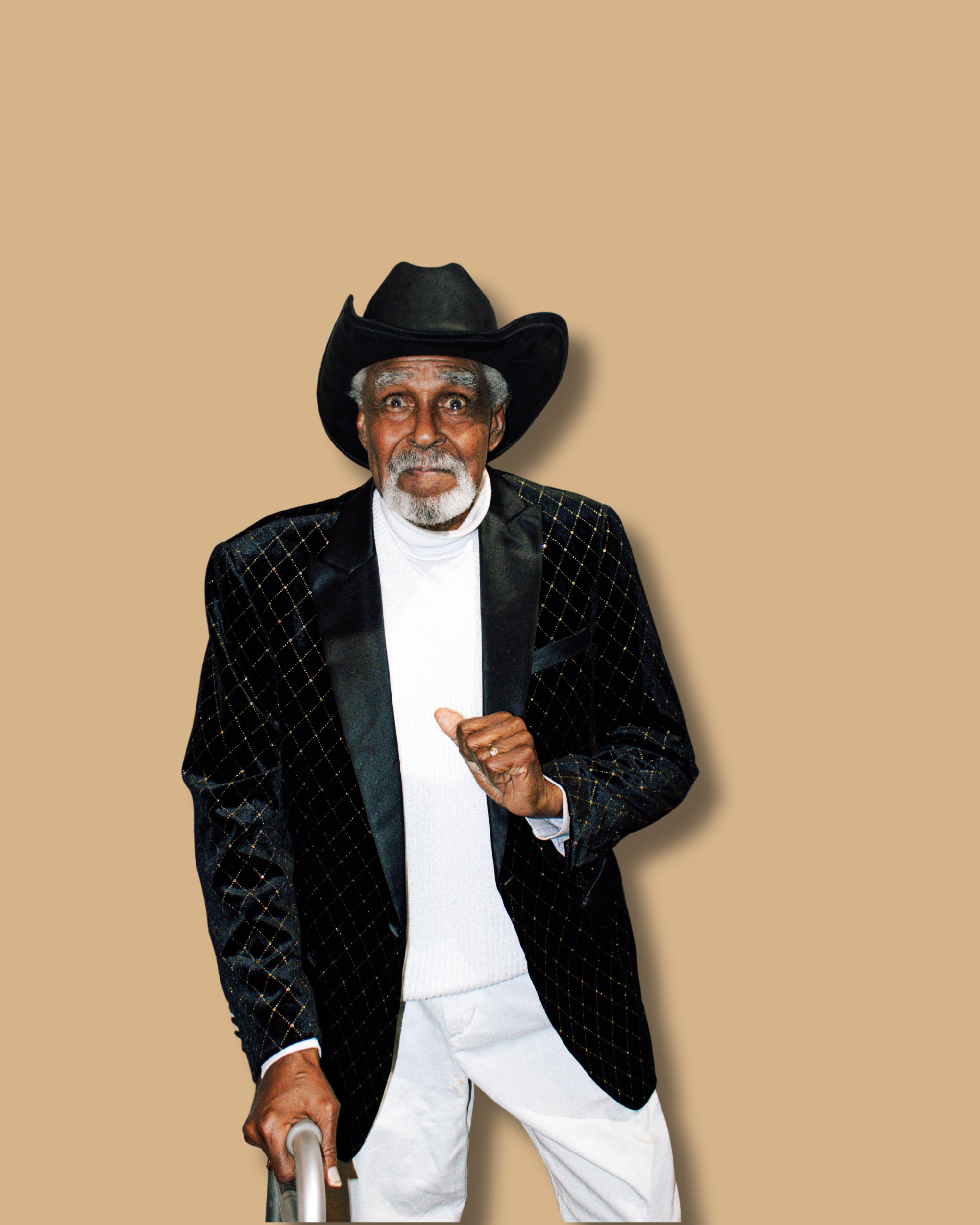Elderly Black man known as Grandpa G smiling in a black cowboy hat and blazer, standing confidently and representing Everybody Loves G Grandkids Club brand